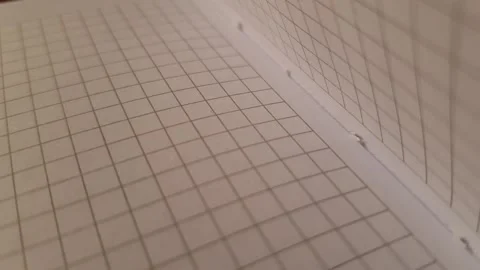 Open checkered notebook, paper background spread. Stock Footage 240128049