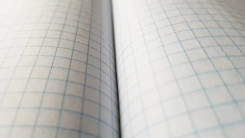 Open checkered notebook, paper background spread. Stock Photos