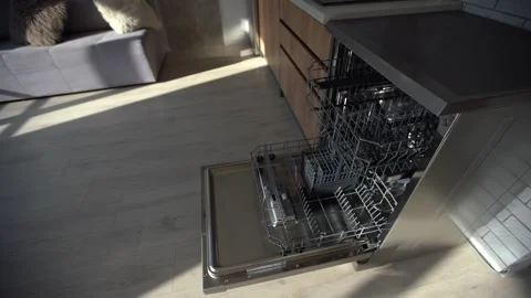 Open clean empty dishwasher in kitchen, closeup Stock Footage 254059633