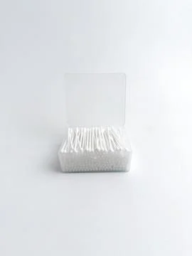 Open clear plastic rectangular box filled with white cotton buds isolated o.. Stock Photos