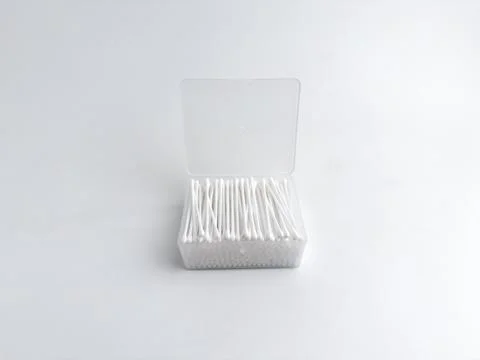 Open clear plastic rectangular box filled with white cotton buds isolated o.. Stock Photos