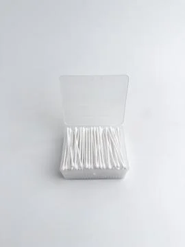 Open clear plastic rectangular box filled with white cotton buds isolated o.. Stock Photos