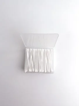 Open clear plastic rectangular box filled with white cotton buds isolated o.. Stock Photos
