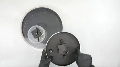 Open a Clock with tool.Black Gloves and Top view. Video stock 146238268
