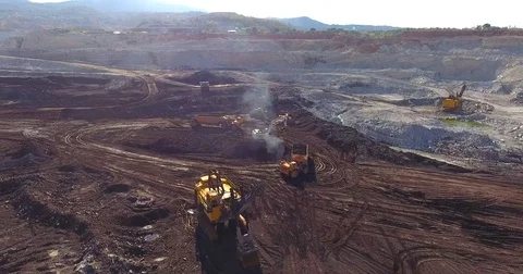 Open Coal Mining Pit and Working Heavy Machines Stock Footage