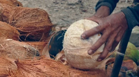 Open a coconut with machette Stock Footage 60706561