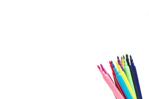 Open colored markers on the corner of a white background Foto stock