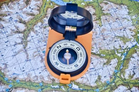 Open compass on the map Stock Photos