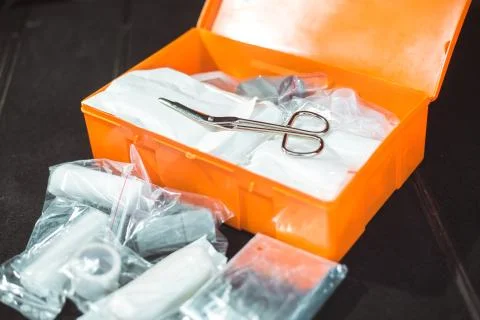 Open compulsory car first aid kit with kind of fisrt aid equipment, healthcare Stock Photos