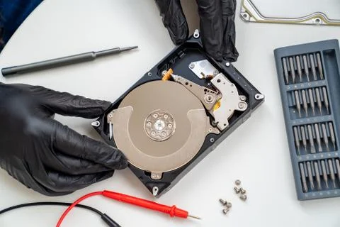 Open Computer Hard Drive. screwdriver set. Hands. Stock Photos