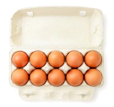 Open container with chicken eggs on a white. The view from the top. Stock Photos