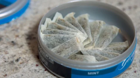Open Container of Nicotine Pouches Video stock 128611682