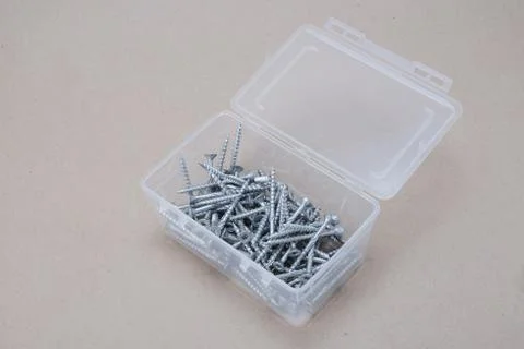 Open container with screws Stock Photos