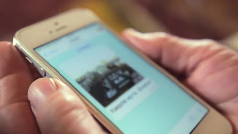 Open conversation on smartphone in hands of elderly woman Stock Footage 230224870