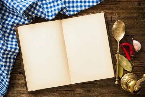 Open cookbook with kitchenware Stock Photos
