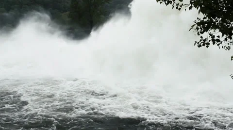 Open dam discharged a large amount of water from lake reservoir, pan left. Stock Footage 37795694