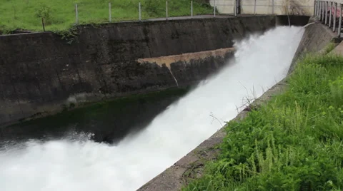 Open dam discharged a large amount of water,close up, tracking shot, pan left. Stock Footage 37796639
