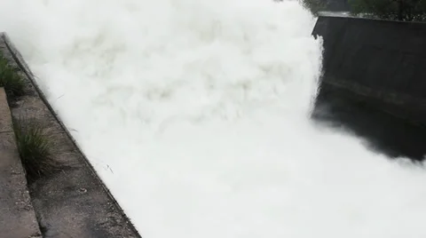 Open dam discharged a large amount of water from lake reservoir, stream, jets. Stock Footage 37811539