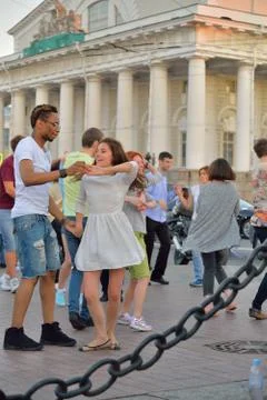 Open dance class on the spit of Vasilievsky island in the evenin Stock Photos