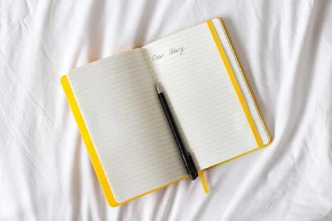 Open diary on a bed Stock Photos