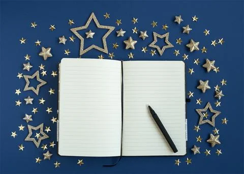 Open diary for plans for the new year with pen decorated with stars Stock Photos