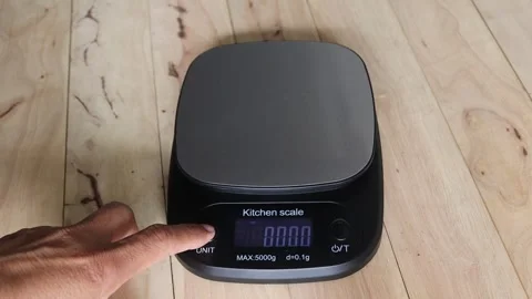 Open the digital scale by hand to test the various units Stock Footage 282627814