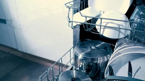 Open dishwasher with clean dishes in the white kitchen Stock Footage 95957375