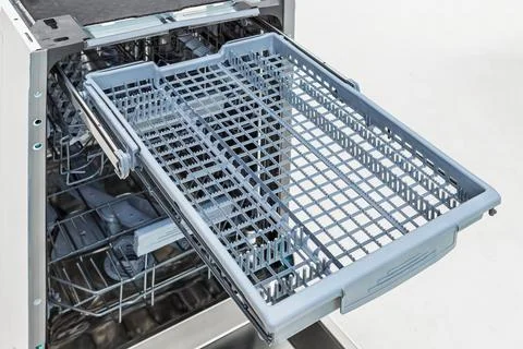 Open Dishwasher Interior On White Stock Photos