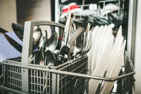 Open dishwasher in a kitchen Stock Photos