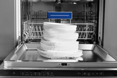 Open dishwasher in the kitchen. Stock Photos