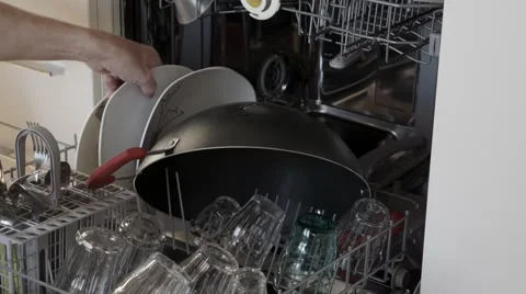 Open dishwasher panel and remove clean dishes Stock Footage 44829797
