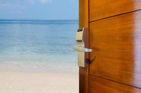Open door with access to the beach, the concept of leisure, travel and holidays Stock Photos