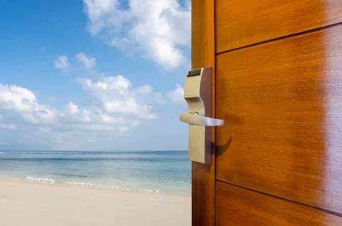 Open door with access to the beach, the concept of leisure, travel and holidays Stock Photos