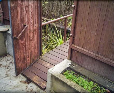Open door in a backyard Stock Photos