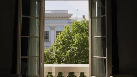 Open door to a beautiful balcony. Light wind outside, view from the luxury hotel Stock Footage 170543539
