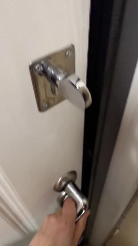 Open the door with the keys and go out into the entrance Stock Footage 313300009