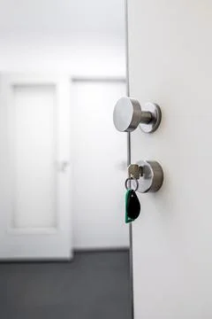 Open door with keys in the lock. 스톡 사진