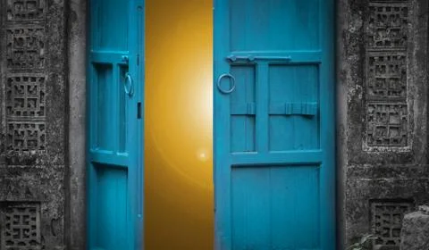 Open door with light behind Stock Photos