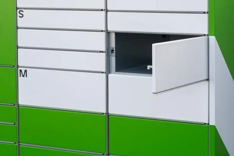 Open door of parcel locker Stock Photos