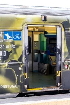 An open door of a train stopped at a platform Stock Photos