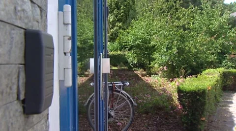 Open a door using a key card, door swings open, person  walks inside Stock Footage 42441100