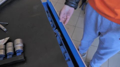 Open the drawer with a car tool Stock Footage 128763900