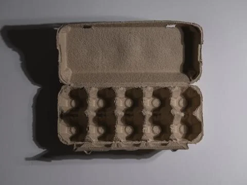 Open egg box with no eggs Stock Photos