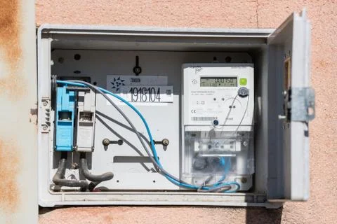 Open electric panel and meter in a street in Caceres, Extremadura, Spain. Stock Photos