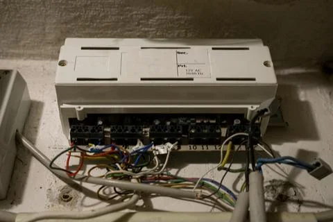 Open electrical control box with colorful wires. Stock Photos