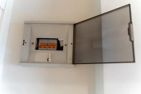 Open Electrical Distribution Box With Circuit Breakers On Wall Stock Photos
