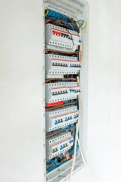 Open Electrical Panel with Circuit Breakers and Color Coded Wiring Stock Photos