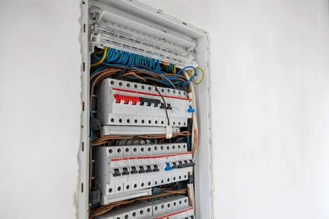 Open Electrical Panel with Organized Circuit Breakers and Wiring Foto stock