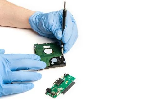 Open an electronic device with gloves under laboratory conditions Stock Photos