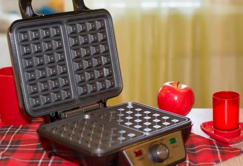 Open electronic waffle-iron. Sample model for a kitchen appliance. Kitchen vi Stock Photos